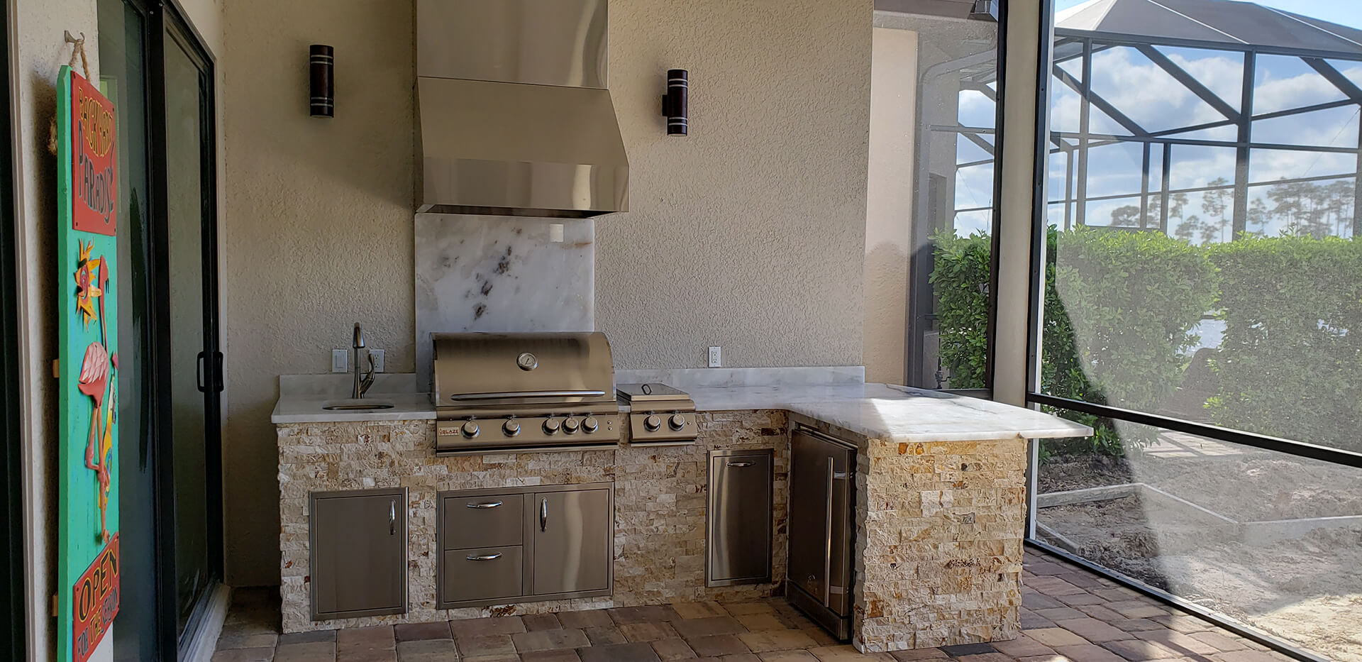 Underlit Crystalo Granite Outdoor Kitchen Creates an Ambient Golden
