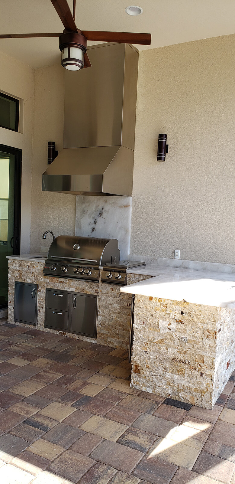 Underlit Crystalo Granite Outdoor Kitchen Creates an Ambient Golden ...